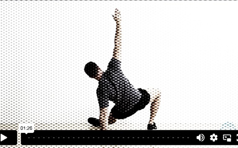 Certified personal trainer demonstrating the bodyweight get-up exercise