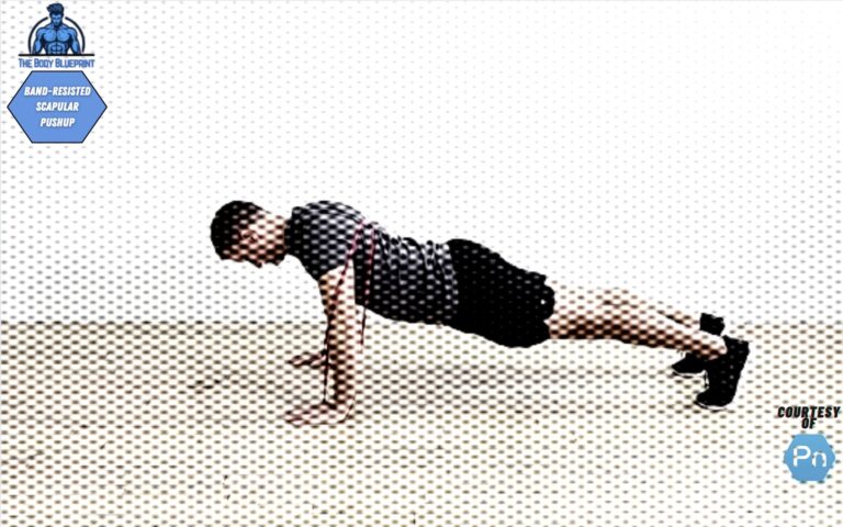 Certified personal trainer demonstrating band-resisted scapular pushup