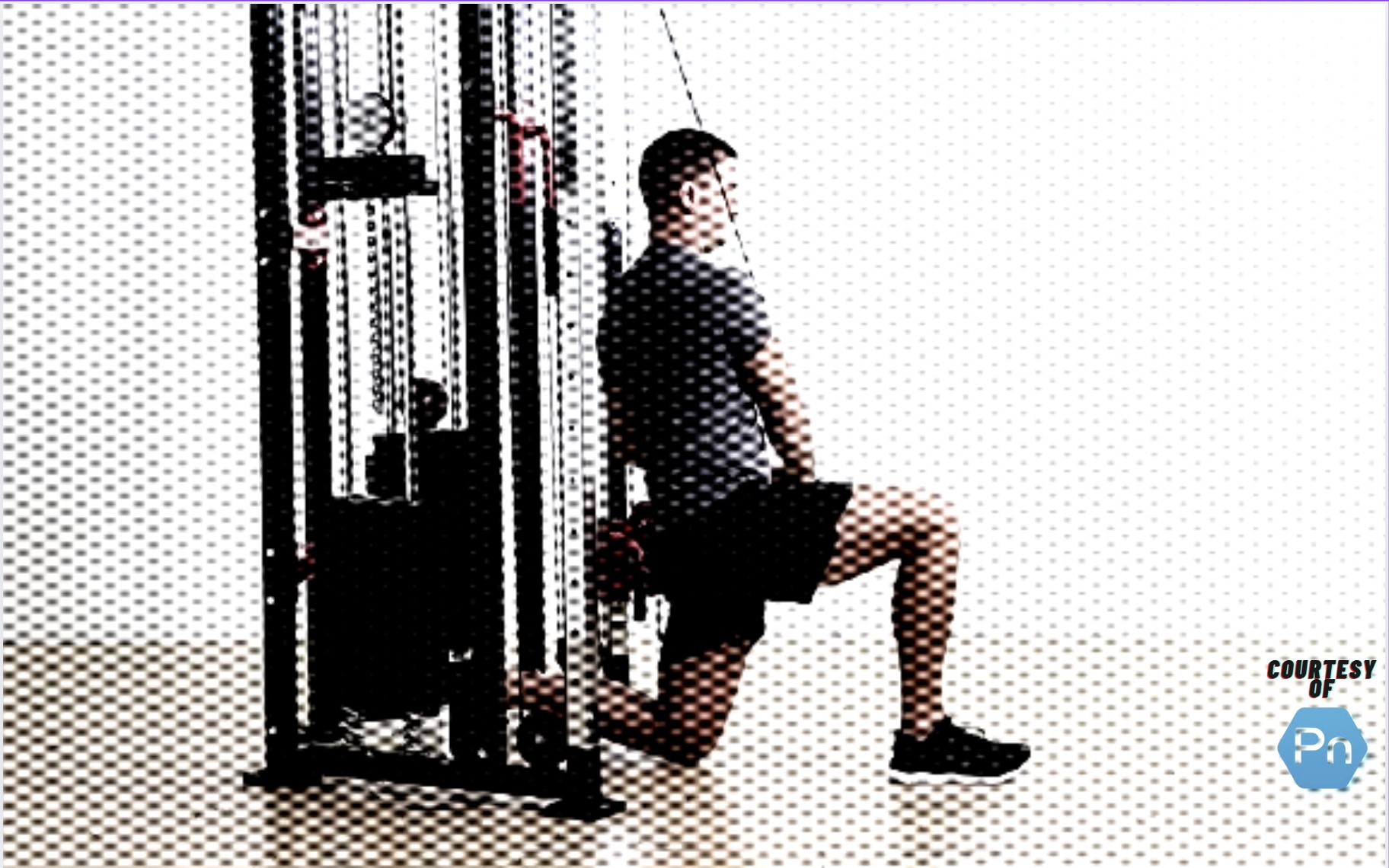 Personal trainer performing the half-kneeling cable chop exercise.