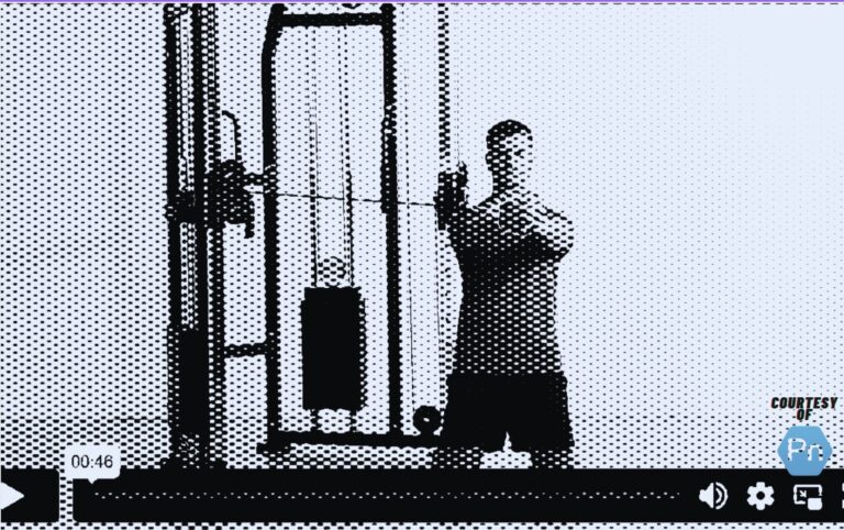 Personal trainer demonstrating the Tall-Kneeling Pallof Press for core stability