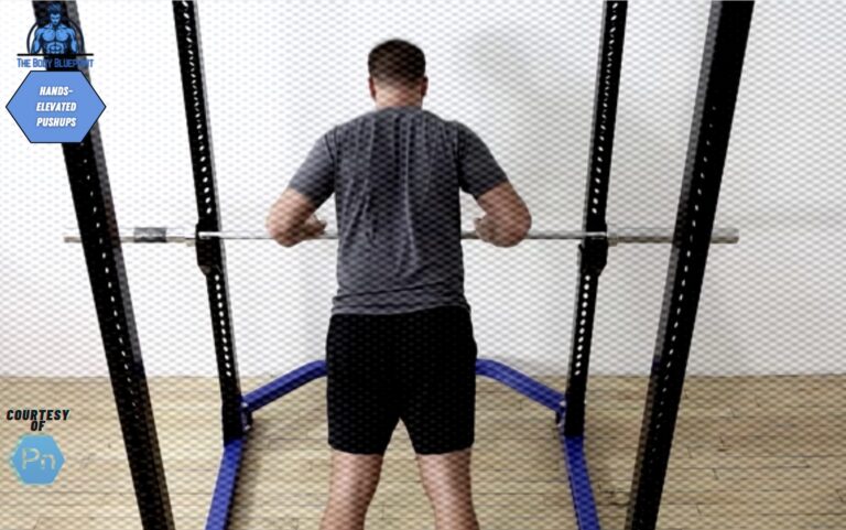 Certified personal trainer demonstrating hands-elevated pushups.