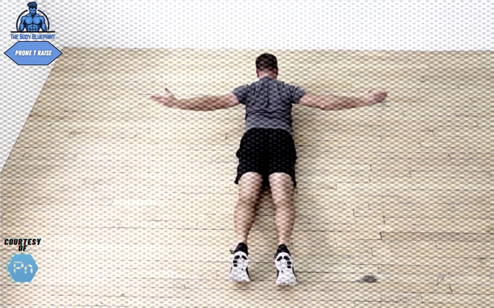 Certified personal trainer demonstrating Prone T Raise exercise.