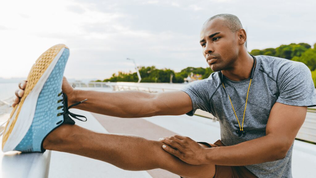 A man loosening up before running.