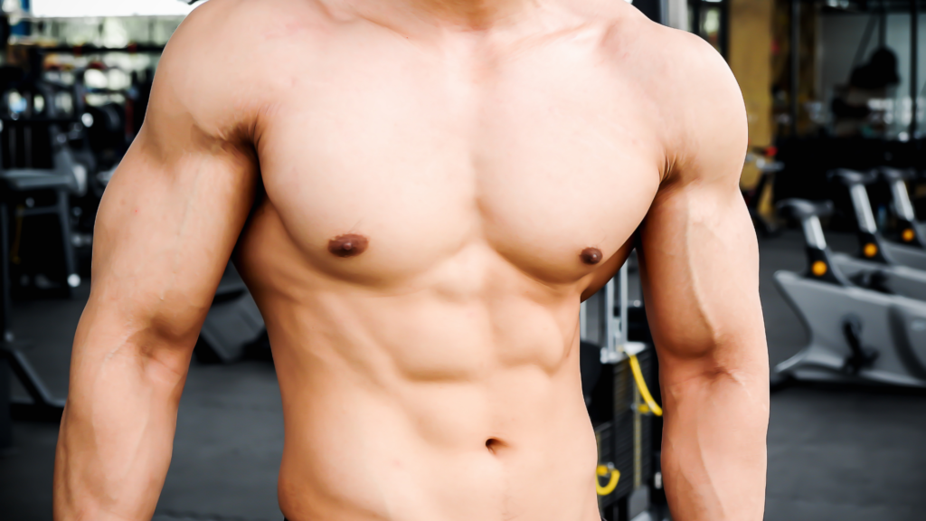 An image of a physically fit man showcasing his well-defined six-pack abs, illustrating the potential results of dedicated fitness training and proper nutrition.