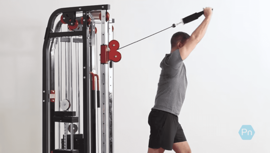 Athlete performing overhead cable triceps extension with rope attachment