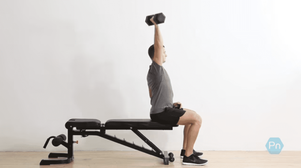 Lifter performing a single-arm overhead press with a vertical spine