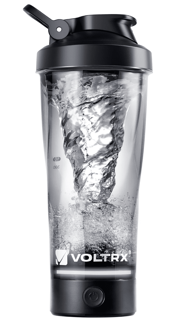 Featured product shot of the VOLTRX electric protein shaker bottle in action, illustrating a powerful internal water vortex created by its high-torque motor base for a clump-free supplement review.