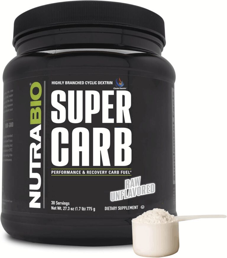 NutraBio Super Carb tub in Raw Unflavored displaying a powder scoop alongside the "Highly Branched Cyclic Dextrin" and "Performance & Recovery Carb Fuel" labels, verifying its formulation for the review.