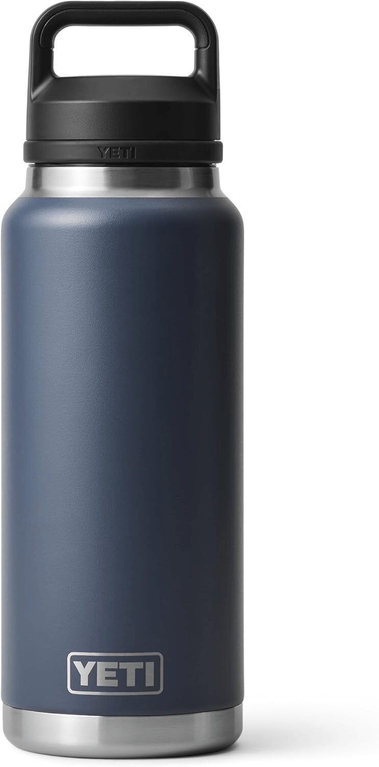 YETI Rambler 36 oz stainless steel water bottle in navy with Chug Cap showing vacuum insulated design
