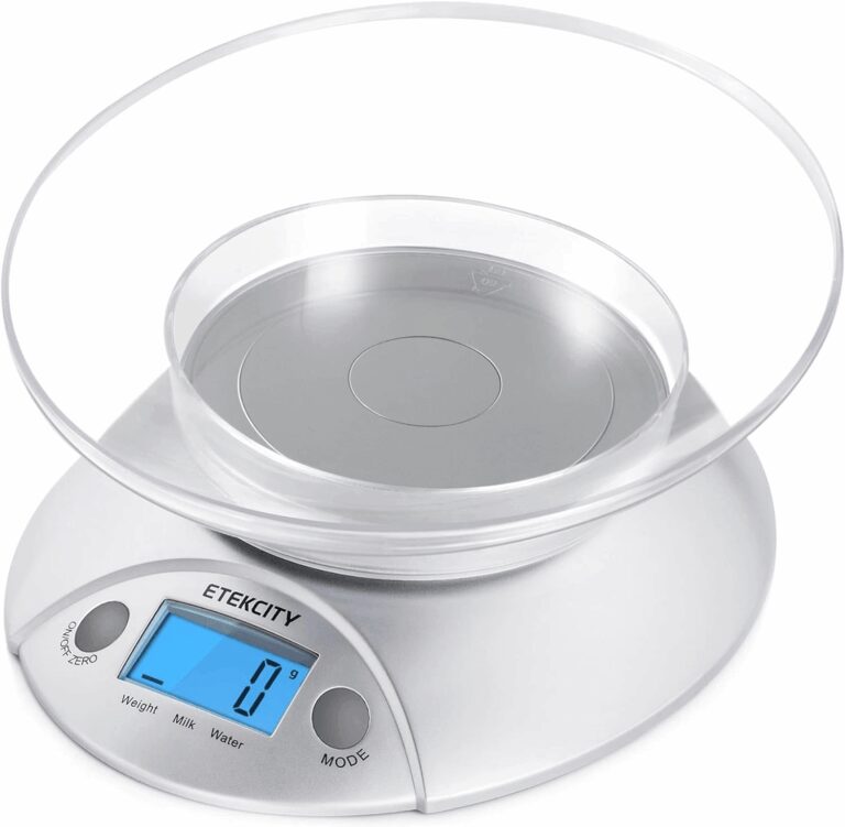 A silver Etekcity digital food kitchen scale featuring a clear measuring bowl on top, displaying 0 grams on a blue backlit LCD screen, highlighting its utility for precise meal prep and macro tracking in the review.
